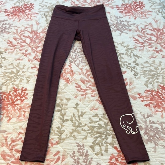 Ivory Ella Maroon colored Leggings, fabric has animal markings throughout - Picture 1 of 7